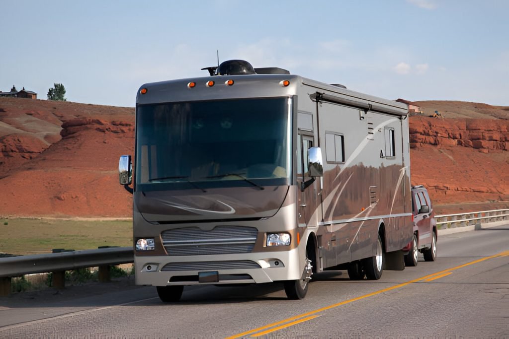 Large brown RV parked on roadway